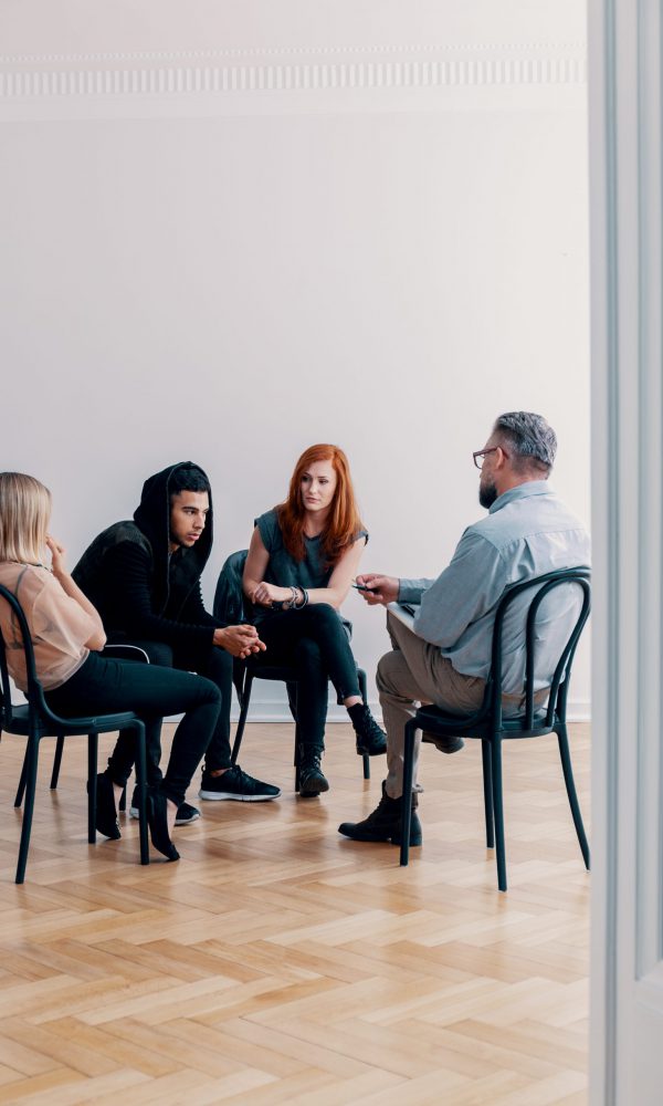 Group,Of,Rebellious,Teenagers,Talking,To,A,Psychologist,In,A